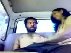 A sexually aroused man in a vehicle receives a steaming orall-service from a lustful Indian harlot.
